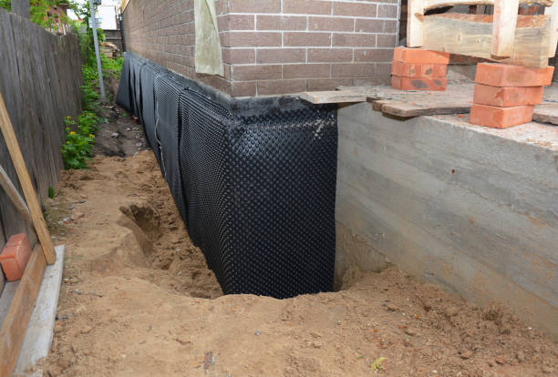 SJ Waterproofing Pros technician performing targeted Waterproofing assessment in Beverly, OH